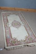 20th century Chinese Imperial Jewel rug, with cream and pink ground decorated with floral design