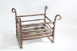 Iron fire basket with scrolled terminals, 38cm wide, 31cm deep, 30cm high