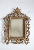 Rococo style gilt metal frame, with pierced swag border and glass panel 30cm tall