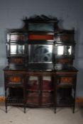 Victorian rosewood and mahogany mirror back sideboard, the mirror back with a scroll carved pediment