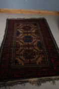 19th century Middle eastern rug, with red, blue and cream ground set with three central guls