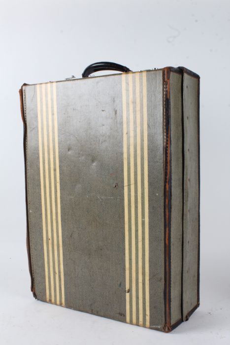 Early 20th Century suitcase, in green with yellow stripes, with fitted compartments for shoes,
