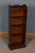 Early 20th century mahogany bookcase, of narrow proportions, with serpentine gallery and beaded