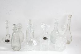 Ten Edwardian and later glass decanters, two with plated decanter labels for Vodka and Apricot