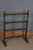 A 20th century oak towel rail, with turned supports and four slats, 92cm high 69cm wide