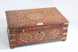 Indian hardwood and bone inlaid box, the hinged lid enclosing a fitted interior with compartments