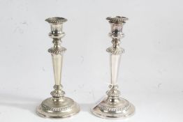 Pair of silver plated candlesticks, with gadrooned sconces and central bands above waisted stems and