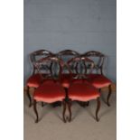 Five 20th century mahogany dinging chairs, with floral decorated backs above red upholstered