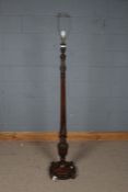 20th century carved oak standard lamp, carved with garlands and leaves, with fluted column and