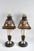 Pair of novelty dumbwaiters, in the form monkeys in costume, 56cm tall (2)
