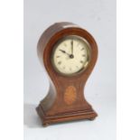 Edwardian mahogany inlaid balloon mantle clock with a circular white dial with roman numerals baring