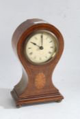 Edwardian mahogany inlaid balloon mantle clock with a circular white dial with roman numerals baring