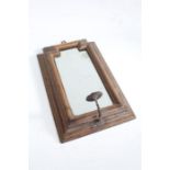 17th century style oak wall mirror, the shaped mirror plate housed in a stepped frame with iron