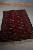 Middle eatsern style rug, the red and white ground set with two rows of elephants foot pattern