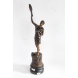 20th century French spelter figure depriving a man with tools holding a torch set on a black painted