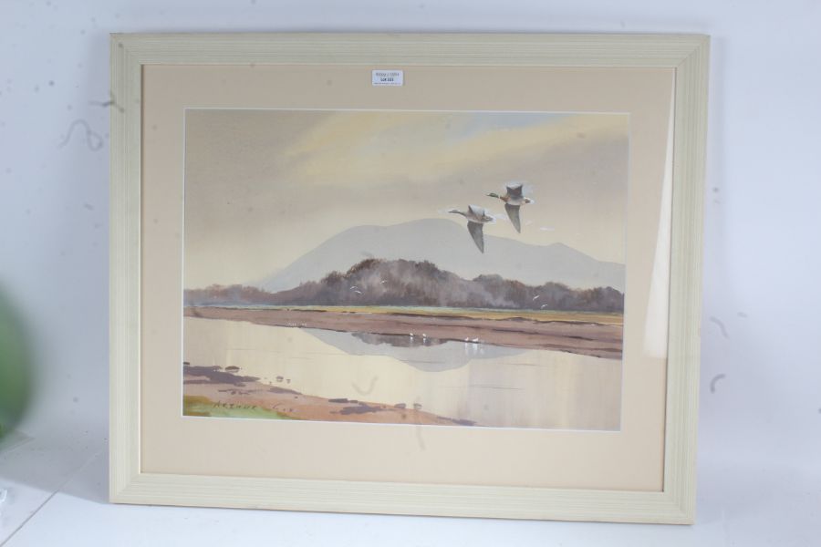 Arthur Gee 20th century watercolour depicting two ducks flying over a lake, signed lower left housed