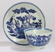 Late 18th Century Liverpool porcelain tea bowl and saucer, with a Oriental figure standing by a lake