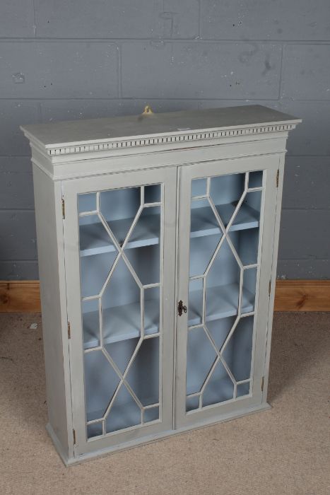 George III style grey painted bookcase, having dentil moulding above a pair of astragal glazed