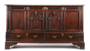An imposing Charles II oak chest, with drawers, circa 1680 The rectangular top with lappet-carved