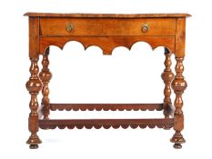 A rare William & Mary yew side table, circa 1700 The crossbanded rectangular top above a frieze
