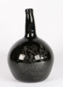 A 19th century green glass 'onion' bottle, Scottish, dated 1830 Engraved with a rampant lion,