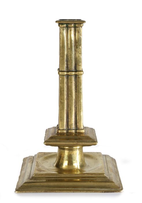 A rare and fine Charles II brass cluster-stem socket candlestick, circa 1680 The cast square stem