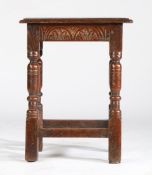 A Charles I oak joint stool, circa 1640 Having a rectangular top with ovolo-moulded edge, lunette-