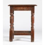 A Charles I oak joint stool, circa 1640 Having a rectangular top with ovolo-moulded edge, lunette-