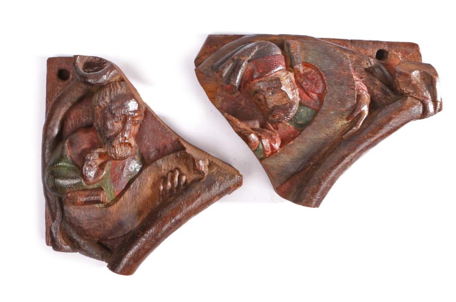 An interesting pair of early 15th century carved oak and polychrome-decorated figural architectural