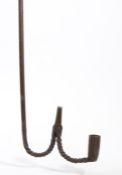 An iron hanging candle/rushlight holder, circa 1800 With with hook terminal, twist-work to the