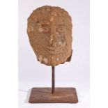 A carved sandstone head, North Country, possibly 12th century With prominent features, including