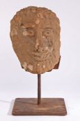 A carved sandstone head, North Country, possibly 12th century With prominent features, including