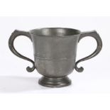 A George II twin-handled pewter ‘loving’-cup, circa 1750 The flared body with mid-fillet and