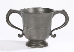 A George II twin-handled pewter ‘loving’-cup, circa 1750 The flared body with mid-fillet and