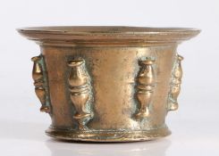 A small 17th century bronze mortar, French Of shallow form, with wide flared rim, and six baluster
