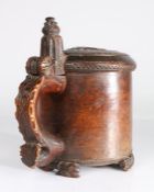An 18th century burr birch peg tankard, Norwegian, circa 1730-50 The gently domed lid naively carved