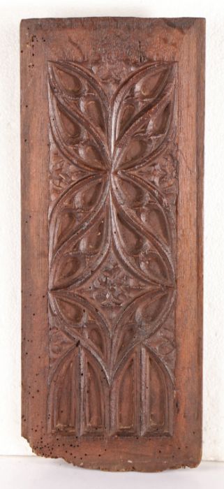 An oak blind-tracery carved panel, circa 1500 Designed with slender tracery light, mouchettes, and