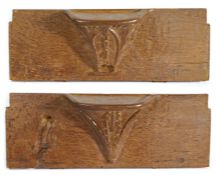 A pair of large mid-15th century oak misericords, circa 1450 Each ‘seat’ corbel carved with paired