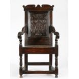 A Charles II oak panel-back open armchair, North Country, possibly Derbyshire, circa 1660 The back