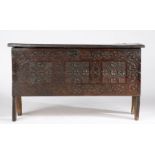 A Charles I oak boarded chest, West Country, circa 1630 The lid formed principally from one board