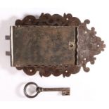 A 17th century steel lock and key Profusely engraved with scrolling foliage, closing with two bolts,