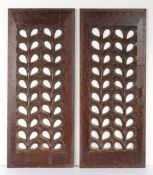 A pair of early 16th century oak carved and pierced panels, English, circa 1530 Each designed with