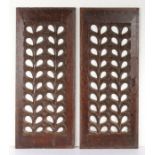 A pair of early 16th century oak carved and pierced panels, English, circa 1530 Each designed with