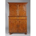 An early 18th century figured-walnut cabinet, English, circa 1720 and later Having a pair of boarded