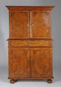 An early 18th century figured-walnut cabinet, English, circa 1720 and later Having a pair of boarded