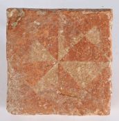 A 14th century floor tile, English Decorated with a geometric design of triangles, 12.3cm square