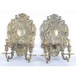 A pair of late 17th century style silvered wall sconces Each with an oval shaped back plate, cast