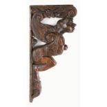 An impressive Elizabeth I carved oak tester bed corbel, circa 1570 Designed as a 'satyr', although