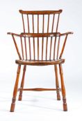 A George III ash and elm comb-back Windsor armchair, West Country, circa 1780-1820 Having eight