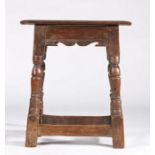 A Charles I oak joint stool, circa 1630 The top with double reeded-edge, the rails with bicuspid-